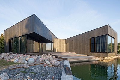 Black House On Nevezis River Slope